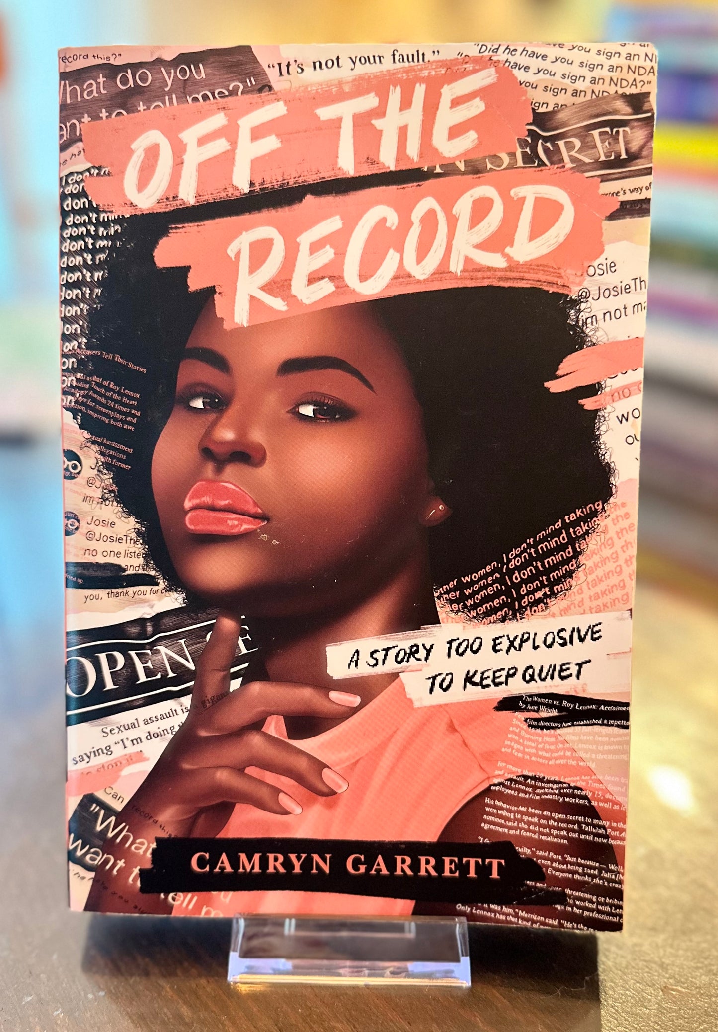 Book cover of 'Off the Record' by Camryn Garrett with a woman's face and text on the cover.