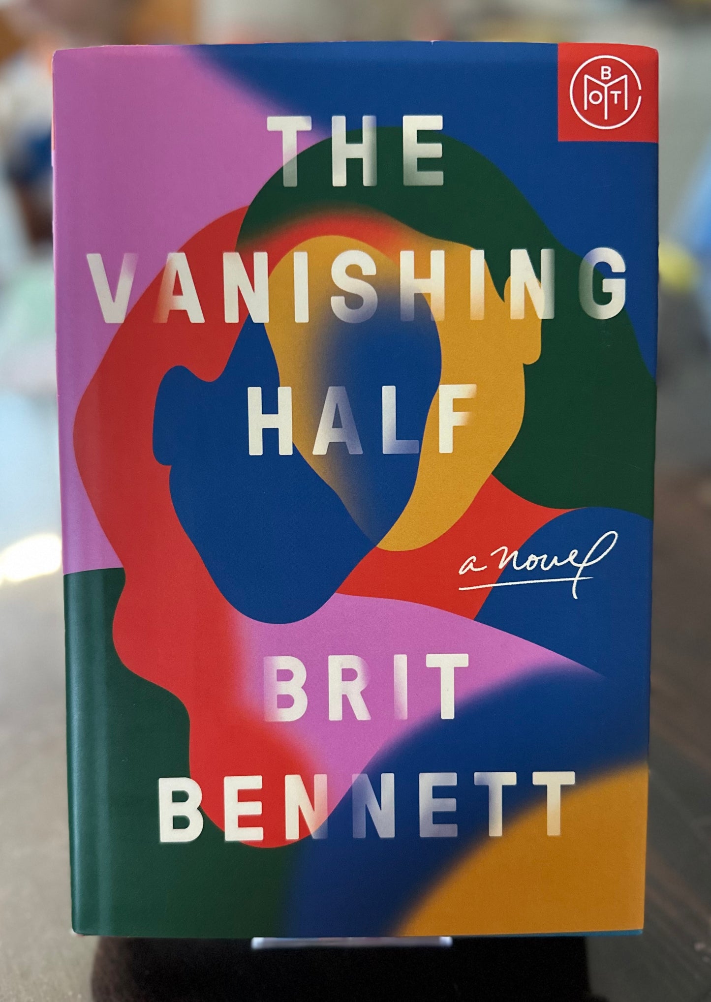 Book cover of 'The Vanishing Half' by Brit Bennett with colorful abstract design